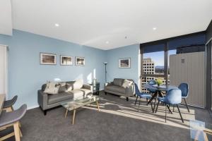 a living room with a couch and a table at Accommodate Canberra - Highgate in Canberra