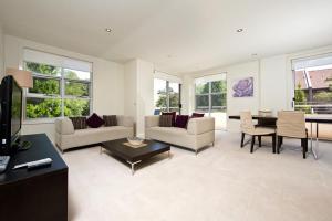 a living room with a couch and a table at Accommodate Canberra - Trieste in Canberra