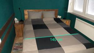 Postel nebo postele na pokoji v ubytování Apartman TIN