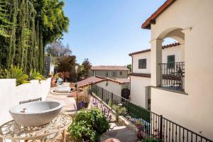 a large tub sitting in the courtyard of a house at Spanish Gem Summer Stay, Filming Events Day Use in Los Angeles