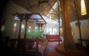 a room with a tent with a bed in it at Saraya in Sangolda