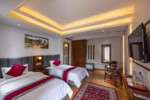 Postel nebo postele na pokoji v ubytování Hotel Ama-La, Thamel, Kathmandu + 37 fotografií
