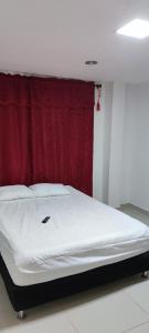 En eller flere senge i et værelse på Posada Dakema