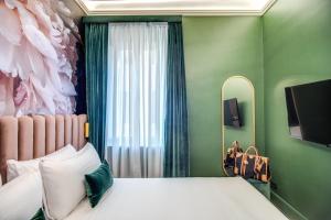 Posteľ alebo postele v izbe v ubytovaní Palazzetto Trevi