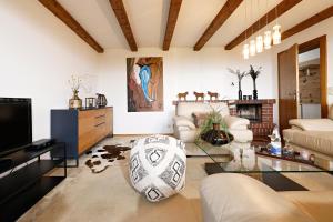 a living room with a couch and a glass table at Ferienwohnung Karin in Kierwang