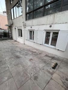 a building with white doors and windows on it at Comfy big apartment in Athens in Athens