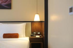 Postel nebo postele na pokoji v ubytování Grand Summit Hotel General Santos