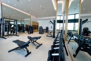 a gym with treadmills and elliptical machines at KeyHost - Stunning 1BR - The Address Beach Residences JBR -Dubai Marina View - K1470 in Dubai