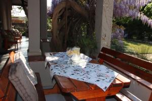 a table with glasses on it on a patio at Top House Bed and Breakfast in Ladybrand