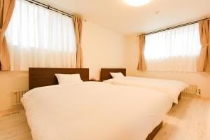 Postel nebo postele na pokoji v ubytování S12 HOTEL