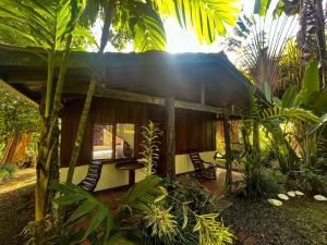 a small house in the middle of a forest at Princesa de la Luna Ecolodge in Fortuna