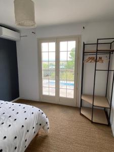 Postel nebo postele na pokoji v ubytování Maison proche du Lac du Salagou