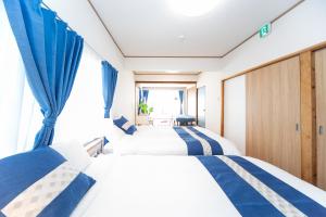 Postel nebo postele na pokoji v ubytování Yokkaichi Motomachi Hotel