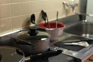 a pot sitting on top of a stove in a kitchen at ノースウエストIR in Kita-rokujō