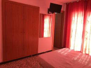 Postel nebo postele na pokoji v ubytování Hotel Iris