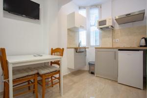 Kuchyň nebo kuchyňský kout v ubytování altea home centre one badroom