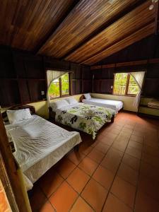 Postel nebo postele na pokoji v ubytování Princesa de la Luna Ecolodge