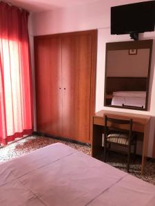Postel nebo postele na pokoji v ubytování Hotel Iris