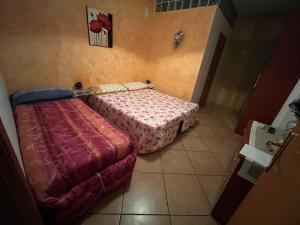 Ένα ή περισσότερα κρεβάτια σε δωμάτιο στο La Rosa Blu Rende
