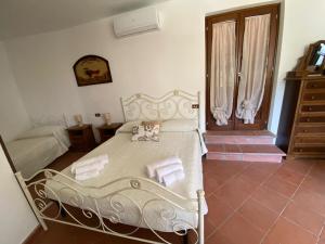 Postel nebo postele na pokoji v ubytování Villa con piscina tra Versilia e Cinque Terre