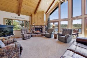 a living room filled with furniture and a fireplace at Cove Lakefront Chalet #2098 by Big Bear Vacations in Big Bear Lake