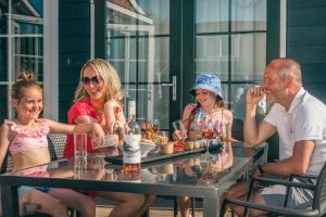 a group of people sitting at a table at EuroParcs De Rijp in De Rijp