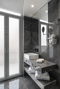 A bathroom at Praxitelous Luxury Suites