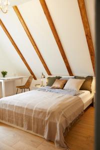 a bedroom with a bed in a attic at Schloss Mörlbach in Mörlbach