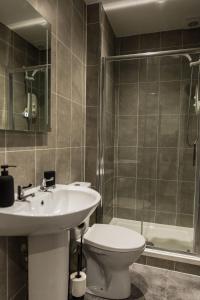 a bathroom with a sink and a toilet and a shower at Crieff House in Crieff