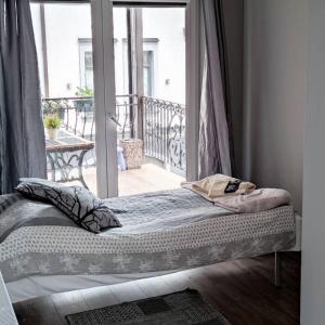 Posteľ alebo postele v izbe v ubytovaní Hotelik Kościerzyna