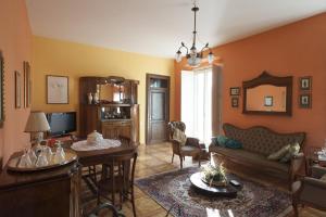 a living room with a couch and a table at B&B La Soffitta Del Barone in Mormanno