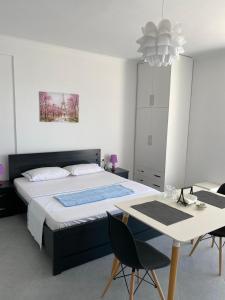 Ένα ή περισσότερα κρεβάτια σε δωμάτιο στο TERRACE VIEW APARTMENTS