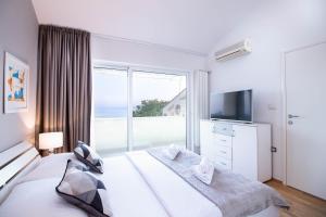 Posteľ alebo postele v izbe v ubytovaní Villa Morčić with a sea view - Rijeka