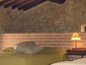 A bed or beds in a room at Agriturismo Le Vigne di Pace