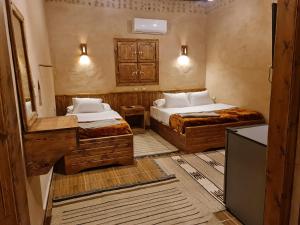 Rúm í herbergi á Qasr El salam