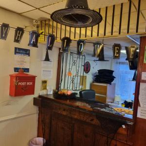 a room with pots and pans hanging on the wall at The New Osterley Hotel in Blackpool