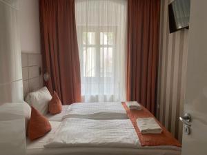 Posteľ alebo postele v izbe v ubytovaní VIP Apartments