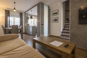 a living room with a couch and a table at Duplex Near the Beach in Chiclana de la Frontera