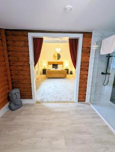 a bathroom with a shower and a tub in a room at Kaoglen Doe-Feature Bathroom-Cairngorms-Pets Allowed in Balnald