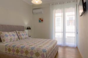 A bed or beds in a room at The Bright Suite