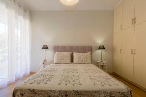 A bed or beds in a room at The Bright Suite