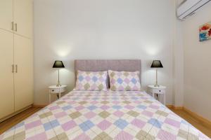 A bed or beds in a room at The Bright Suite