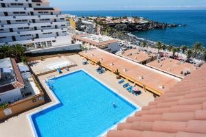 The swimming pool at or close to Seguro El Sol en Playa de la Arena