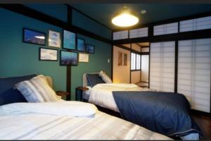 Postel nebo postele na pokoji v ubytování 民宿　setouchi