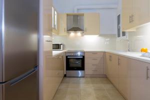 A kitchen or kitchenette at The Bright Suite
