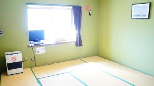 TV a/nebo společenská místnost v ubytování Black Diamond Lodge + 14 fotografií