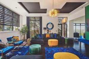 a living room with a couch and a table at Reservoir View in Cheddar