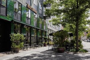 a street with tables and chairs in front of a building at Boutique Hotel Danmark in Copenhagen