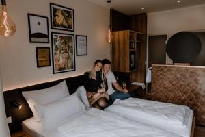 Postel nebo postele na pokoji v ubytování Weinzuhause Hotel-Restaurant-Vinothek