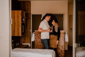 Postel nebo postele na pokoji v ubytování Weinzuhause Hotel-Restaurant-Vinothek